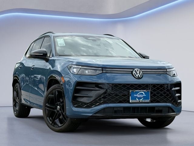 2026 Volkswagen Tiguan 2.0T SE R-Line Black in Monterey Blue Pearl — front three-quarter view