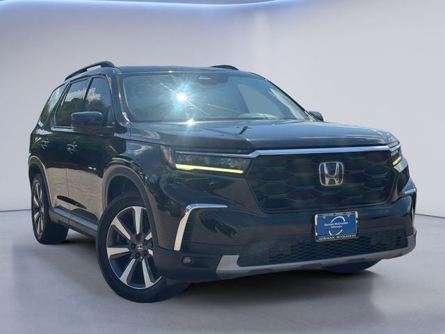 2023 Honda Pilot Touring in Black — front three-quarter view