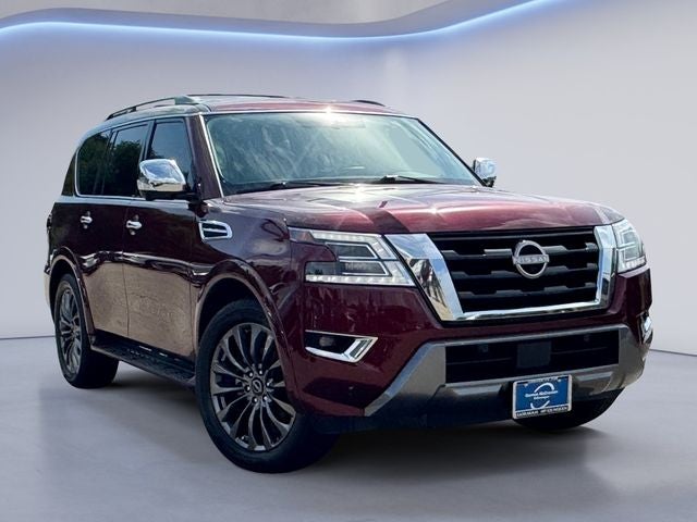 2023 Nissan Armada Platinum in Coulis Red Pearl — front three-quarter view
